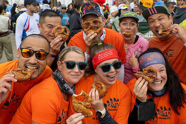 A group of finishers enjoys fresh pretzels.